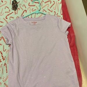 a purple sparkly shirt